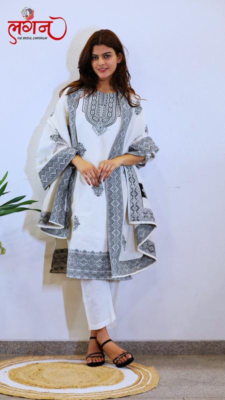A white suit with grey embroidery